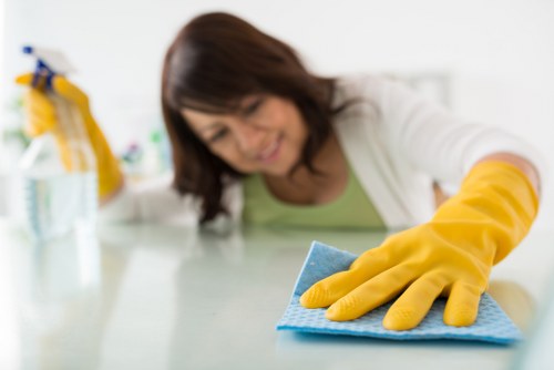 Hampstead cleaner arranging a tidy bedroom during a home clean